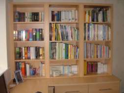 Bookcase fitted ontop of an L shaped desk